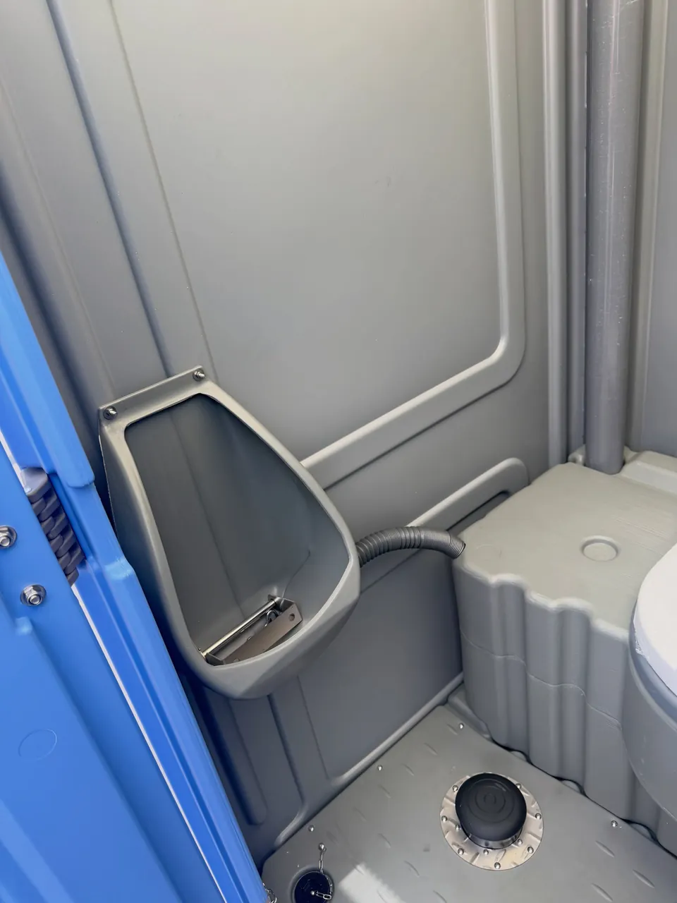 Urinal inside a portable restroom