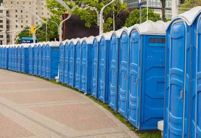 a row of portable restrooms at a fairground, offering visitors a clean and hassle-free experience in tulare